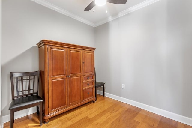 interior space featuring crown molding, ceiling fan, and light hardwood / wood-style floors