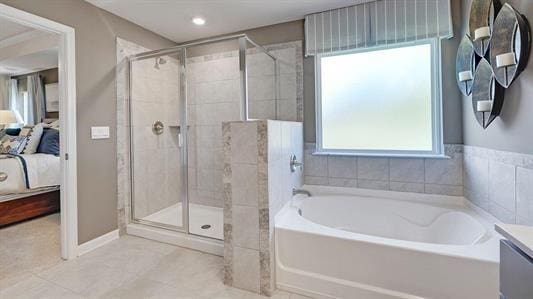 bathroom with separate shower and tub and vanity