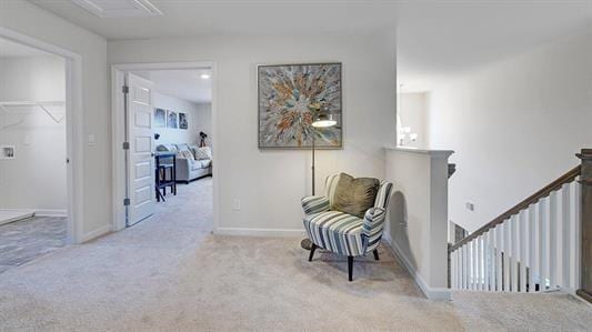 living area featuring light colored carpet