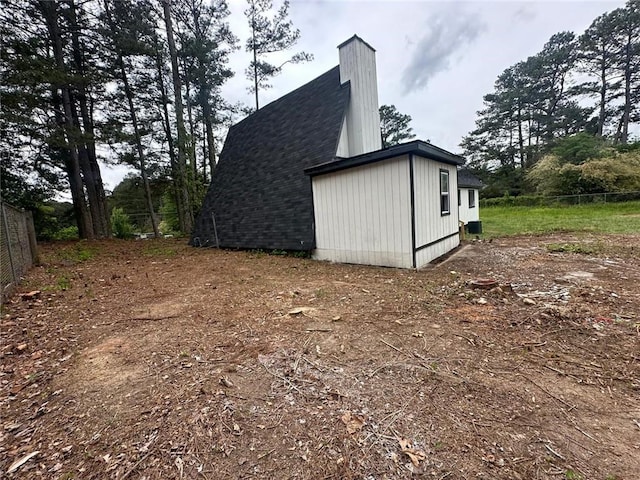 6774 Collier Rd, Riverdale, GA 30296 - view of side of home with roof with shingles