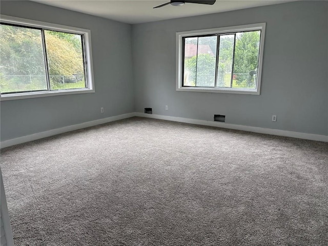 6774 Collier Rd, Riverdale, GA 30296 - empty room featuring a ceiling fan, baseboards, and carpet floors