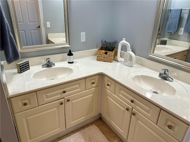 bathroom with tile patterned floors and vanity