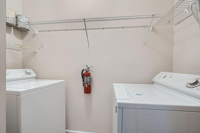 washroom featuring washer and dryer