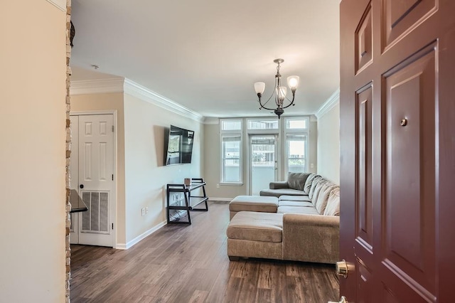 sitting room featuring ornamental molding, hardwood / wood-style floors, and a chandelier