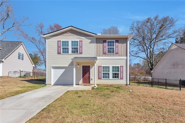 traditional-style house featuring board and batten siding, a front yard, fence, and driveway