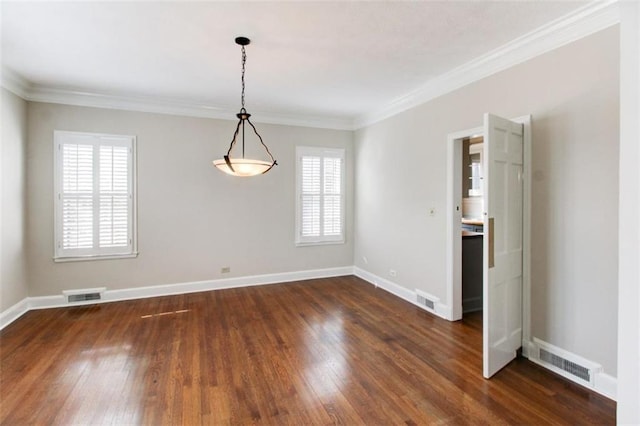 empty room with ornamental molding and dark hardwood / wood-style flooring