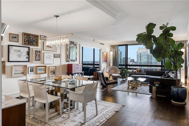 dining space featuring crown molding, dark hardwood / wood-style flooring, and a chandelier