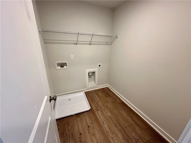 washroom featuring electric dryer hookup, hardwood / wood-style floors, and hookup for a washing machine