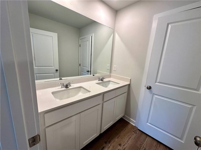 bathroom featuring hardwood / wood-style flooring and vanity