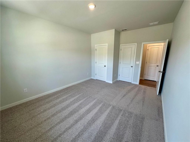 unfurnished bedroom featuring carpet flooring