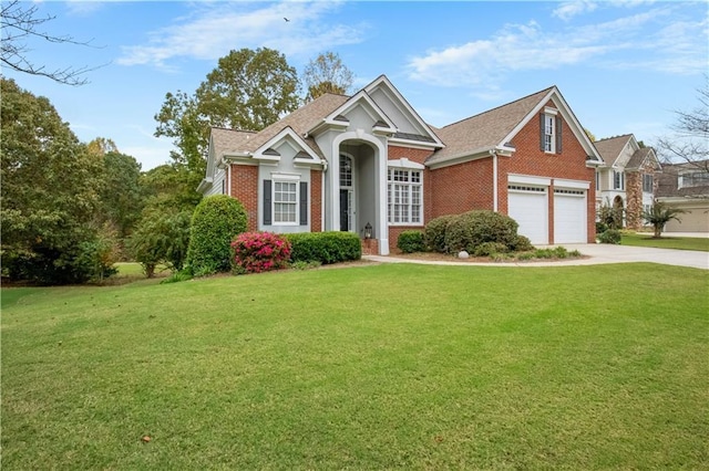 view of front facade with a garage and a front yard