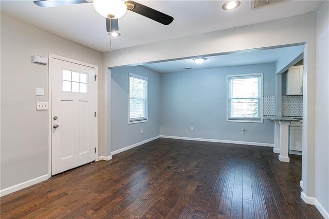 foyer entrance featuring dark hardwood / wood-style floors and ceiling fan