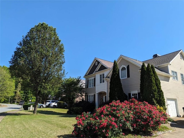 1919 Barrett Knoll Cir NW, Kennesaw, GA 30152 - view of side of home featuring a lawn and an attached garage