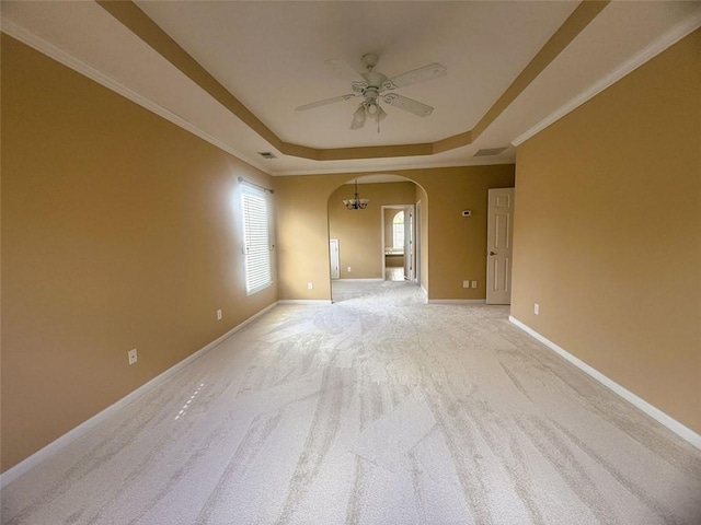 1919 Barrett Knoll Cir NW, Kennesaw, GA 30152 - empty room featuring a ceiling fan, a tray ceiling, arched walkways, light colored carpet, and baseboards