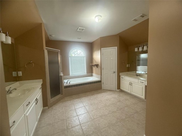 1919 Barrett Knoll Cir NW, Kennesaw, GA 30152 - bathroom featuring two vanities, tile patterned floors, a shower stall, and a garden tub