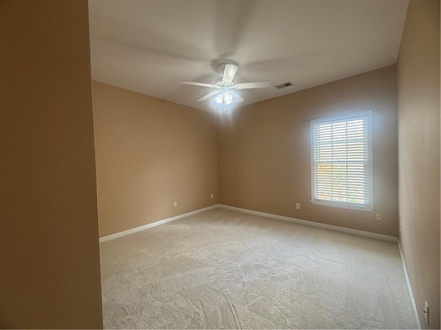 1919 Barrett Knoll Cir NW, Kennesaw, GA 30152 - spare room with light colored carpet, a ceiling fan, and baseboards