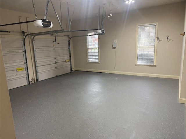 1919 Barrett Knoll Cir NW, Kennesaw, GA 30152 - garage with a garage door opener and baseboards