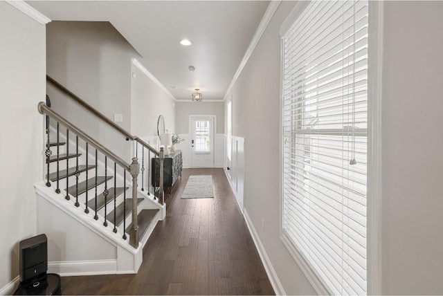 entrance foyer featuring crown molding, recessed lighting, stairway, wood finished floors, and baseboards