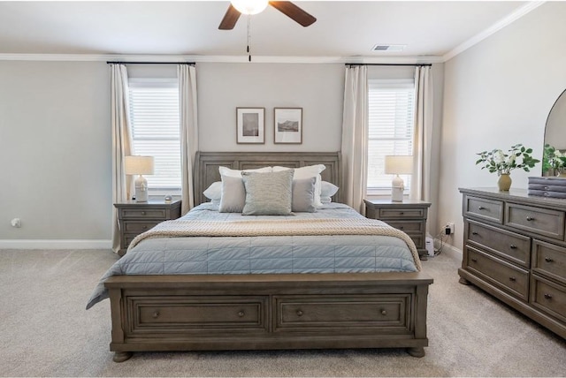 bedroom featuring baseboards, visible vents, light colored carpet, ceiling fan, and crown molding