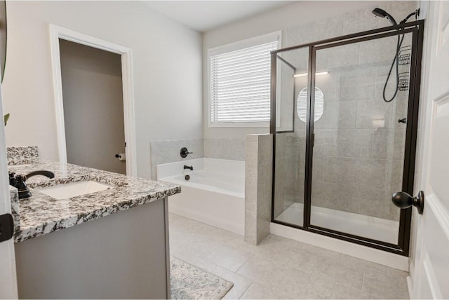 full bath with tile patterned flooring, a shower stall, vanity, and a bath