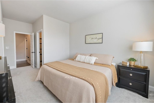 carpeted bedroom featuring baseboards