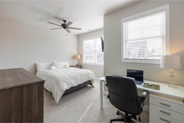 bedroom featuring ceiling fan and light colored carpet