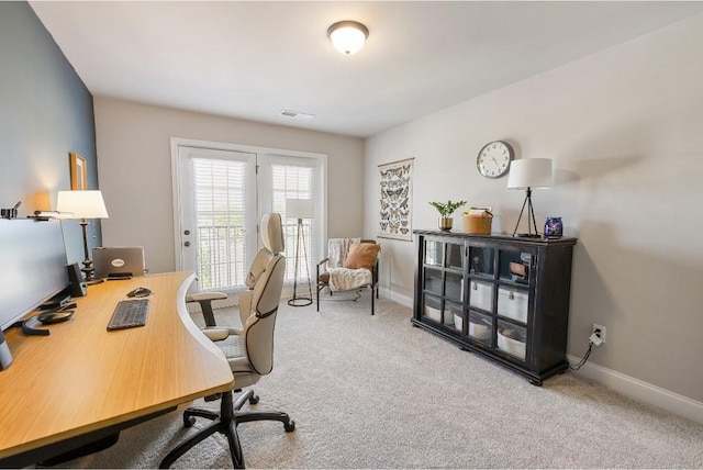 office with carpet, visible vents, and baseboards