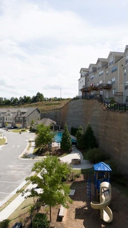 exterior space with fence and a residential view