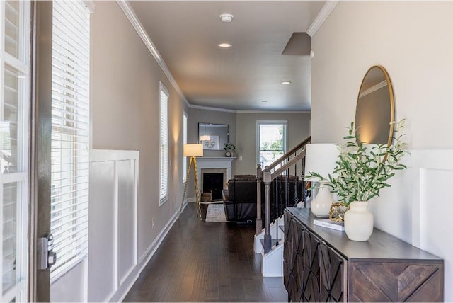 hall with baseboards, dark wood-style floors, ornamental molding, stairs, and recessed lighting