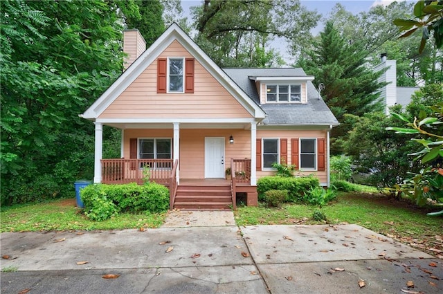 3135 Washington Rd, Atlanta, GA 30344 - bungalow-style home with covered porch and a chimney
