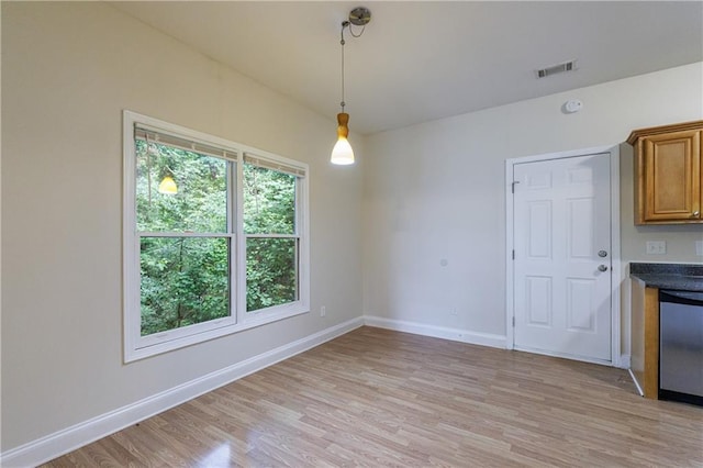 3135 Washington Rd, Atlanta, GA 30344 - unfurnished dining area featuring light wood finished floors and baseboards