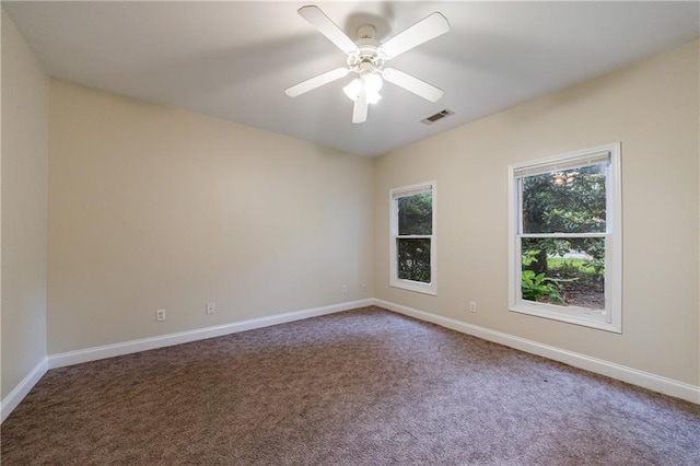 3135 Washington Rd, Atlanta, GA 30344 - carpeted spare room with baseboards and a ceiling fan