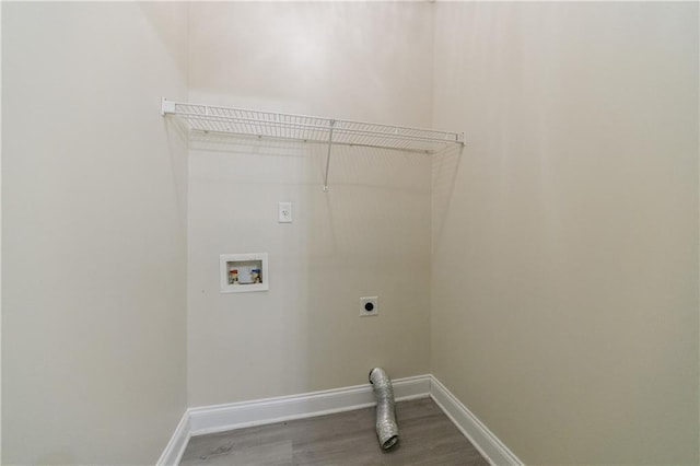 3135 Washington Rd, Atlanta, GA 30344 - laundry room with electric dryer hookup, washer hookup, wood finished floors, and baseboards