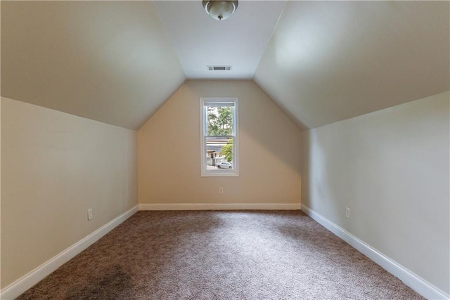 3135 Washington Rd, Atlanta, GA 30344 - additional living space with carpet floors, vaulted ceiling, and baseboards