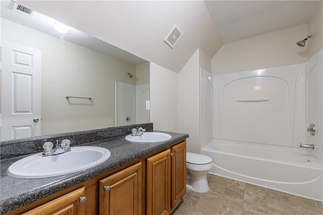 3135 Washington Rd, Atlanta, GA 30344 - bathroom featuring shower / bath combination, toilet, double vanity, and stone finish flooring