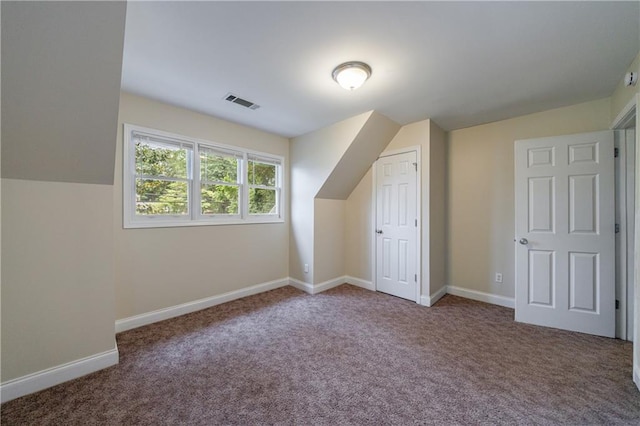 3135 Washington Rd, Atlanta, GA 30344 - additional living space featuring carpet flooring, baseboards, and vaulted ceiling