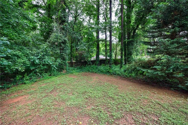 3135 Washington Rd, Atlanta, GA 30344 - view of yard with a wooded view