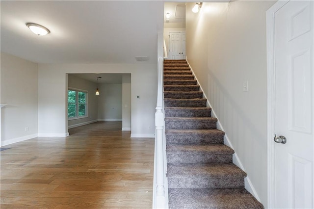 3135 Washington Rd, Atlanta, GA 30344 - staircase with wood finished floors and baseboards