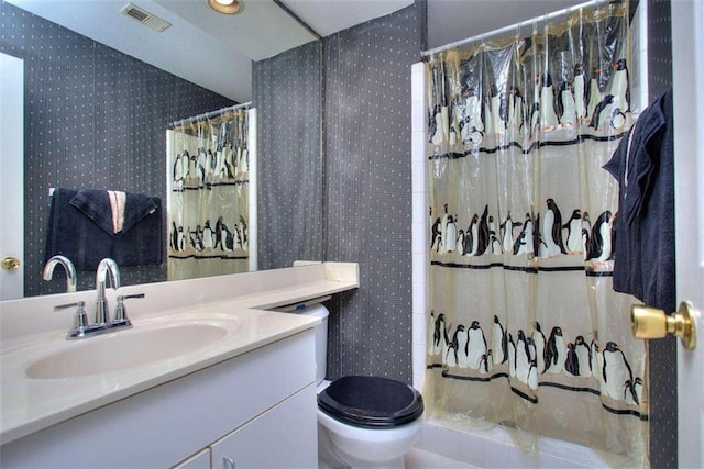 bathroom featuring visible vents, toilet, a shower with shower curtain, vanity, and wallpapered walls