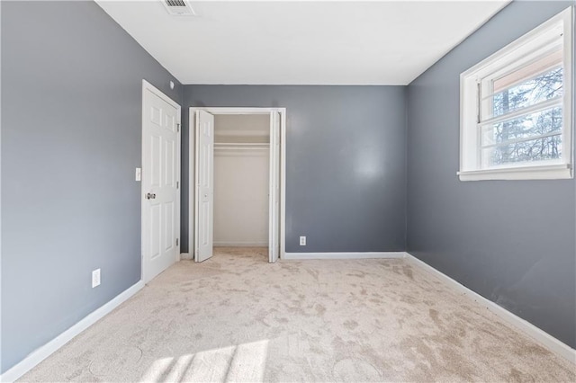 unfurnished bedroom featuring light colored carpet