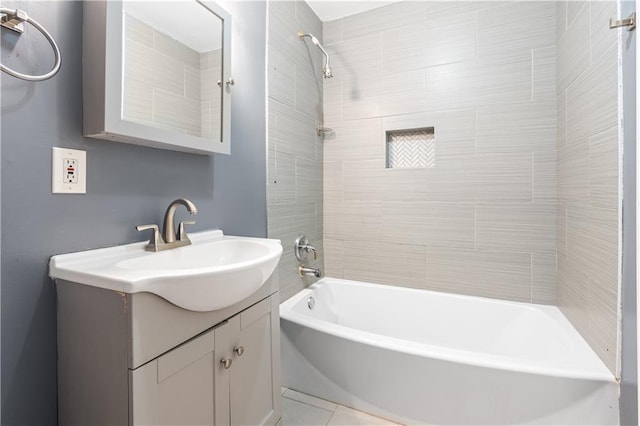 bathroom featuring vanity and tiled shower / bath combo