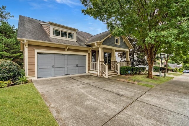 view of front of property with a garage and covered porch