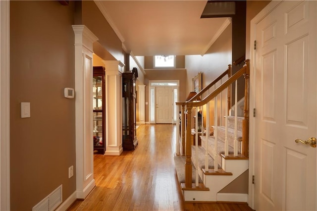 3071 Intrepid Wake, Marietta, GA 30062 - entryway with ornamental molding, decorative columns, light wood-style floors, and stairway