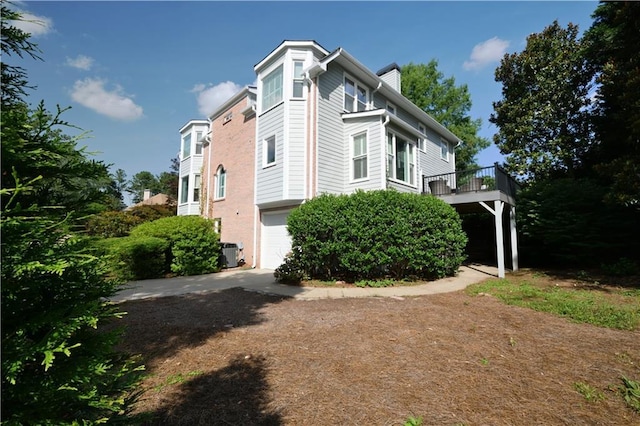 3071 Intrepid Wake, Marietta, GA 30062 - view of side of property featuring a cooling unit and an attached garage