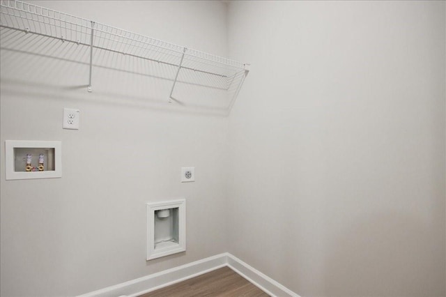 laundry area featuring dark wood-type flooring, baseboards, washer hookup, laundry area, and electric dryer hookup