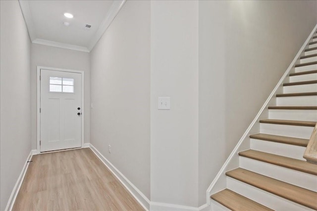 doorway to outside with baseboards, recessed lighting, stairs, crown molding, and light wood-type flooring