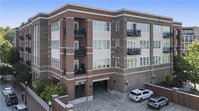 view of apartment building / complex with an attached garage