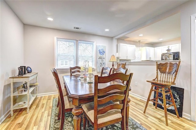 dining area with light hardwood / wood-style flooring