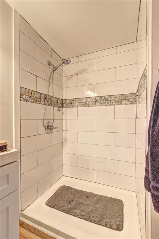 bathroom with tiled shower