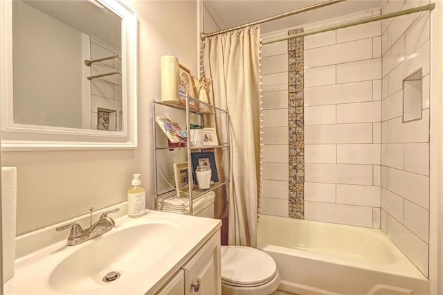 full bathroom with shower / tub combo, vanity, and toilet